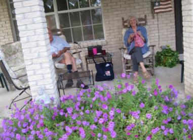 And my favorite... a summer afternoon with Dear Heart and my knitting with the Laura Bush petunias in bloom.